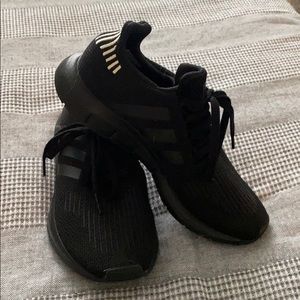 Black Adidas running shoes